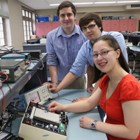 Students working on an electrical board